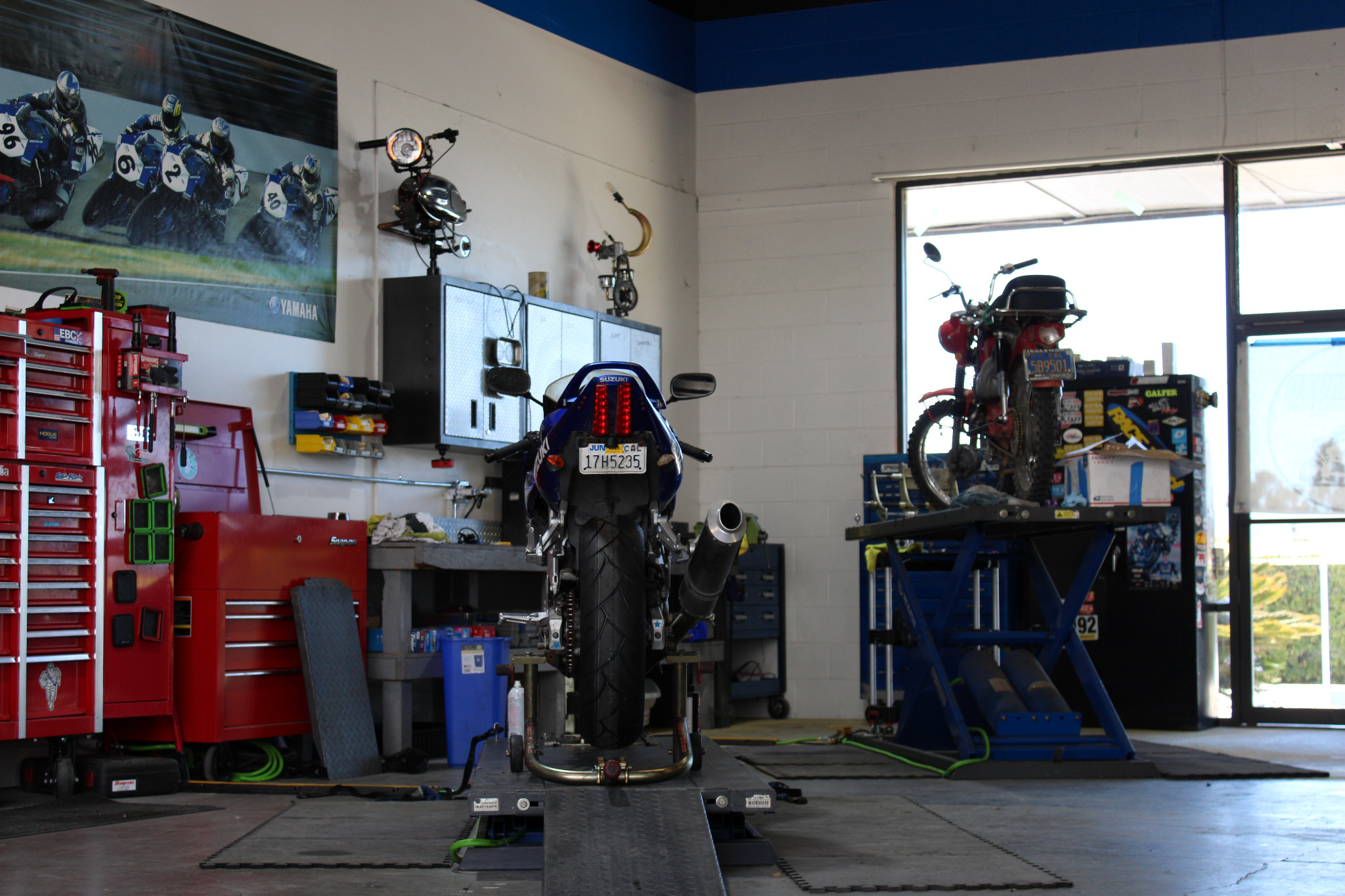 Motorcycle on a lift inside the service bay