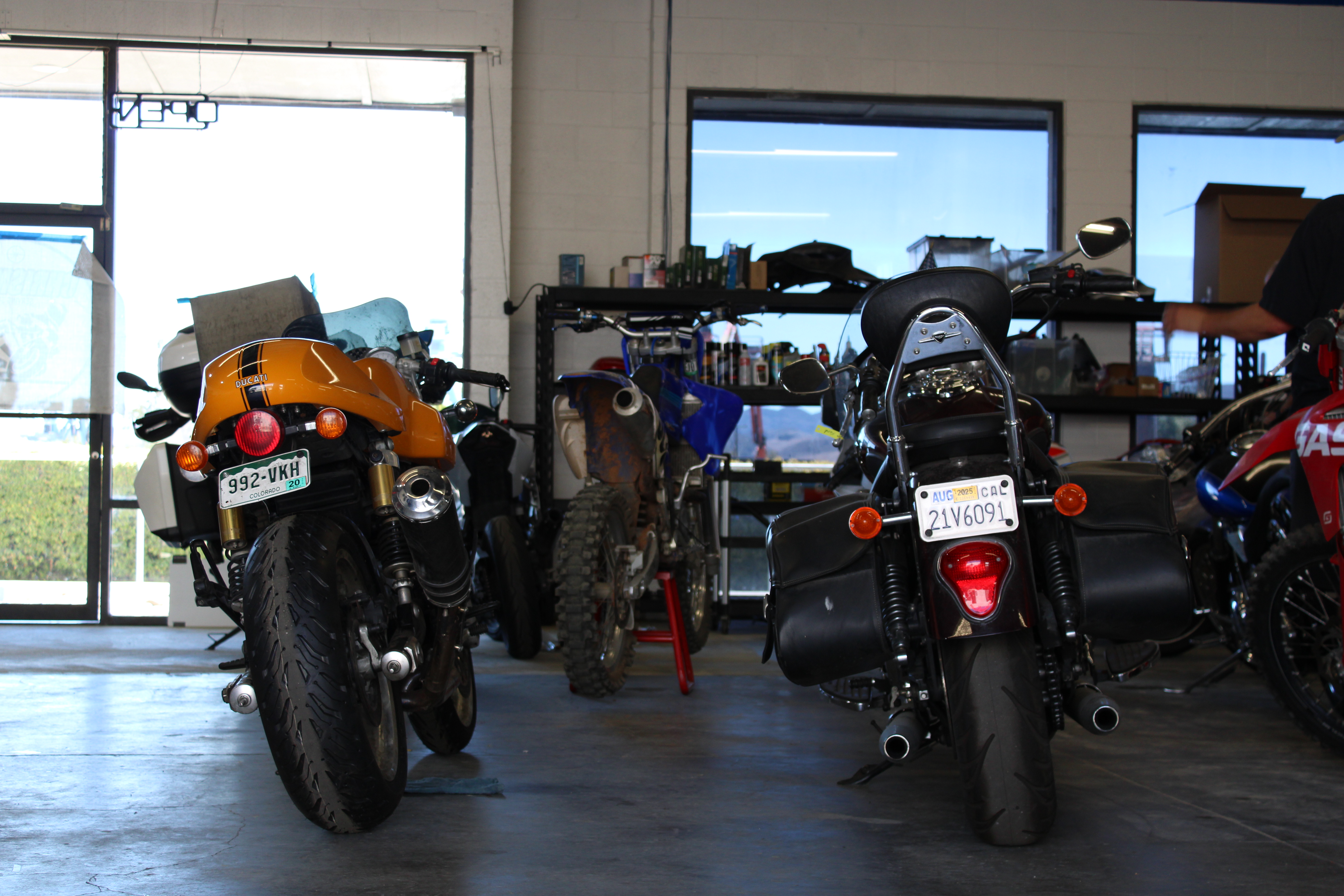 Motorcycle tires stored on a wall rack