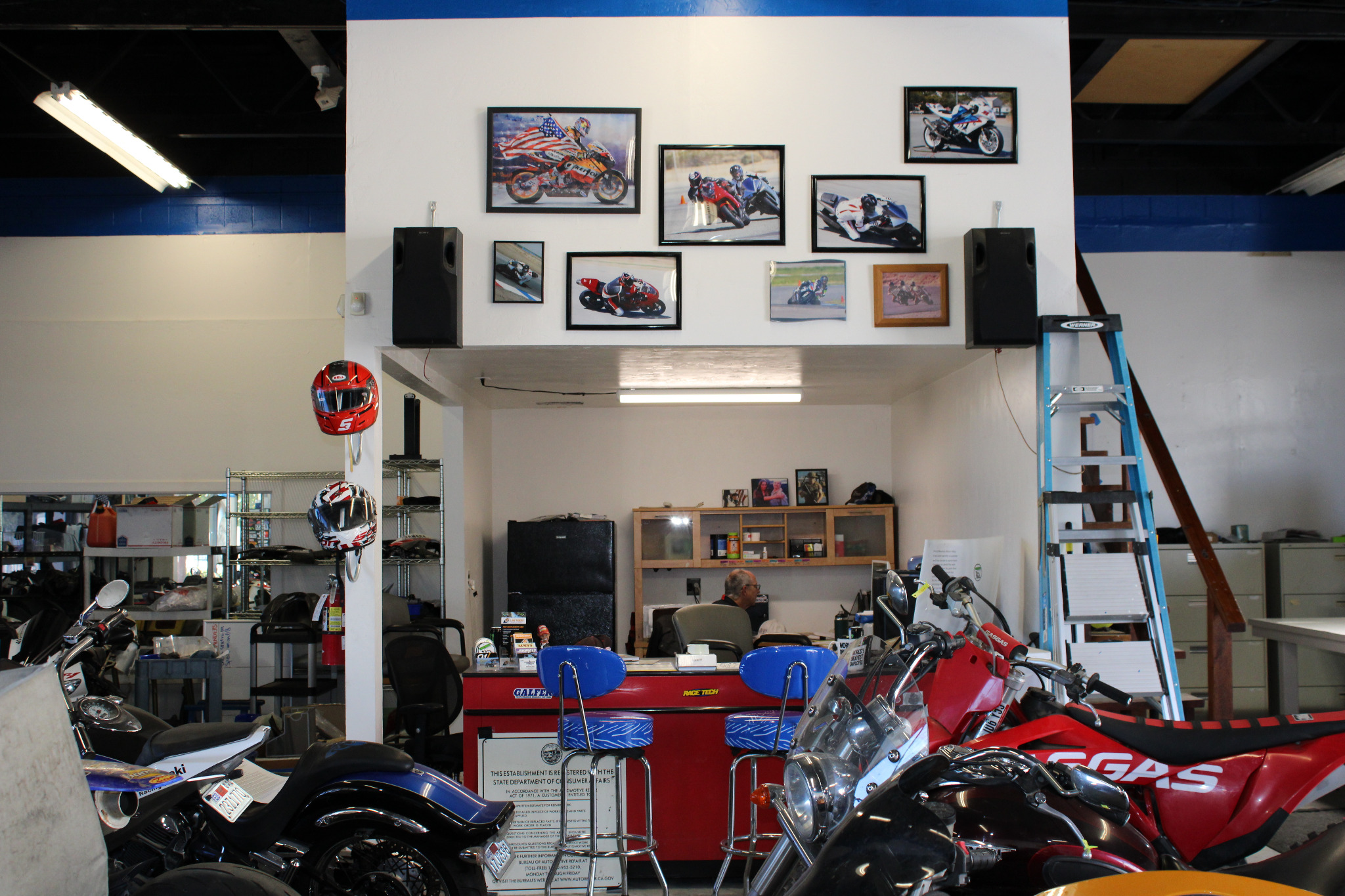 Inside the Chris Moto shop with motorcycles and work area